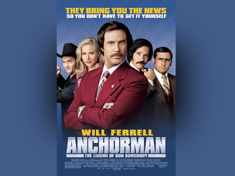 Movie poster for Anchorman: The Legend of Ron Burgundy featuring five news team members posed confidently against a blue background. At the center, a man with styled brown hair and a thick mustache wears a burgundy suit and stands with arms crossed. Behind him are four colleagues: a blonde woman in pink, a man in a cowboy hat, a dark-haired man with a mustache, and a man with glasses in a brown suit. Bold yellow text at the top reads, “They bring you the news so you don’t have to get it yourself.” Large silver text at the bottom displays the title Anchorman, with “Will Ferrell” above it.