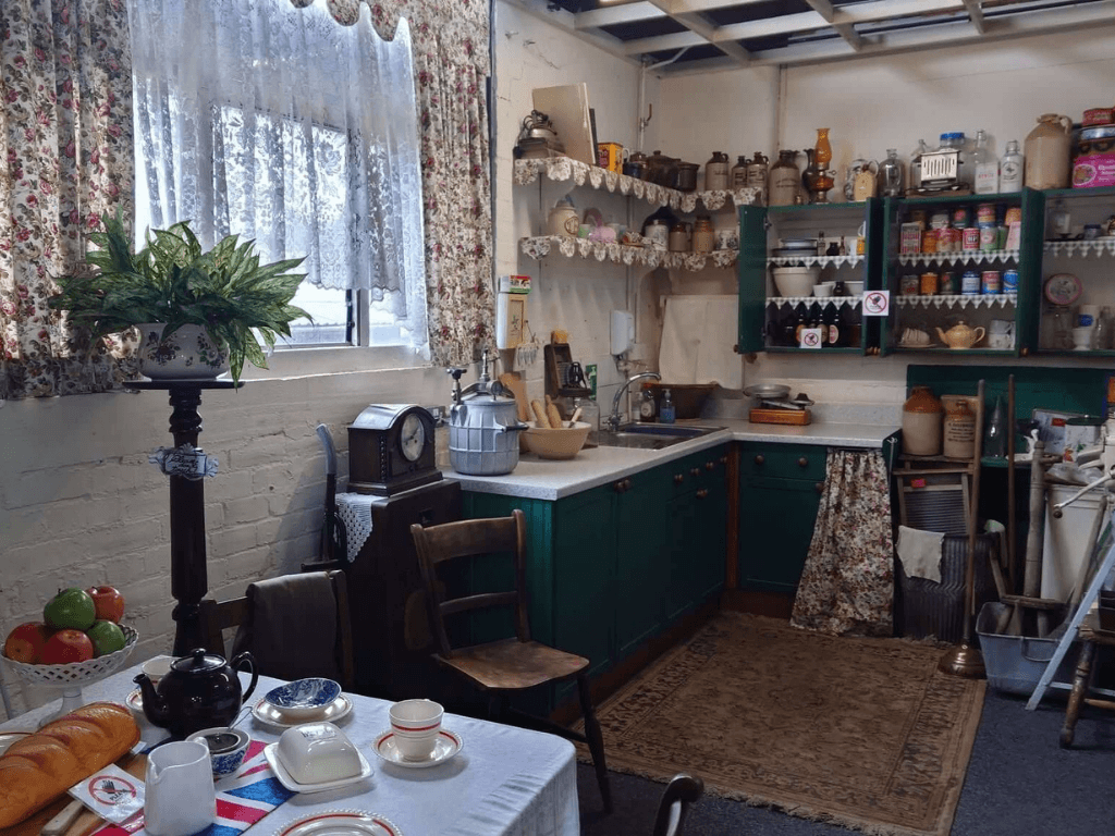Recreated early twentieth century kitchen display showing domestic life during Leigh's textile industry era.